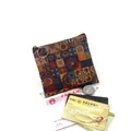 Close-up of cork coin purse with vintage geometric print, cash, and bank cards inside - Cork Pattern No.4