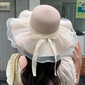 Detail of pink straw sun hat featuring elegant lace bow and organza wavy brim design - Solid Color Mesh Veil Pink