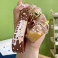Brown bear milk tea keychain with liquid quicksand, gold bell and silicone strap - Lidded Milk Tea Cup + Silicone Strap Style