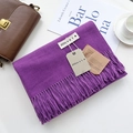 Solid deep purple cashmere-feel scarf with fringe and brand tag on a neutral tabletop - Purple / 200cm