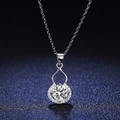 Silver gourd necklace with large central crystal and diamond accents on dark background - Xl-108