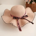 Pink straw sun hat with wide wavy brim and LOVE ME ribbon bow for summer beach - Pink