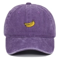 Detailed view of banana embroidery and vintage washed texture on the purple baseball cap - Purple
