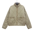 Detailed view of olive green quilted jacket featuring a stand collar and large front pockets - XS / Khaki
