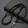 Detailed shot of tiger eye and obsidian beads with a silver cross pendant on leather - 8mm Matte Black Yellow Tiger Eye