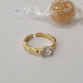 Detailed macro of gold lava texture open ring with oval clear zircon stone setting - Adjustable Open / Gold/White Zirconia
