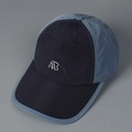 Dettaglio del tessuto ripstop e del logo AB ricamato su un cappellino da baseball - M(56-58cm) / Nero Color Block