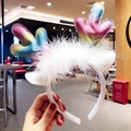 Rainbow gradient reindeer antlers headband with white feathers and soft plush texture - Colorful Antlers