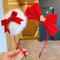 Red velvet bow headband for girls featuring white plush pom-poms and golden heart charm - Heart Bow Headband