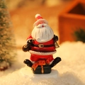 Miniature Santa Claus figurine on black gift box base for Christmas desktop decoration - Santa Claus with Bell