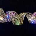 Golden LED ribbon with black stars and music notes glowing with multicolor lights - Gold Foil Ribbon (colorful) / 2 Meters