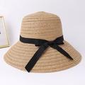 Stylish khaki straw sun hat with large brim and black ribbon bow for women's beachwear - One Size / Light Coffee