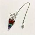 Macro detail of hexagonal resin pendant with 7 chakra crystals and pentagram charm - Colorful Star Moon Style