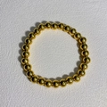 Golden stainless steel beaded bracelet with polished round metal beads on white background - 7mm Round Beads / Gold
