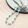 Detail of handmade beaded lanyard with green stones, pearls and golden lobster clasp - Turquoise Natural Stone Beaded Charm (K3503)