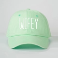 Detail of mint green cotton baseball cap with white WIFEY printed text embroidery - Light Green