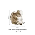 White Nordic style resting angel resin figurine, dimensions 12cm by 11cm, weight 330g - Leaning Knee Thinking Right Angel