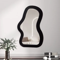 Minimalist cloud-shaped wall mirror featuring a thick black wavy frame in a modern room - Black Curve