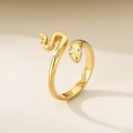 Macro detail of golden snake ring featuring sparkling crystal eyes and polished texture - Full Zircon Snake Style-Gold (KR100461-K)
