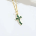 Minimalist gold chain necklace featuring a curved cross pendant with a green gemstone - Gold Green Zirconia Curved Cross