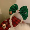 Detail of Christmas headband with green glitter bow, gift box and Merry Christmas plaque - 15# Large Green Bow Headband (DN1525)