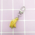Mini creative banana keychain with shiny yellow finish and silver metal clasp on pink background - Banana/Yellow