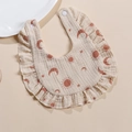 Muslin cotton baby bib with ruffle edges and warm sun moon star print patterns - Sun Moon