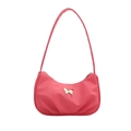 Pink pleated crescent shoulder bag featuring a decorative golden butterfly and slim strap - Pink