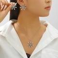 Detail showing elegant snowflake pendant necklace and earrings with pearl and rhinestones - 25 Earrings + Necklace Style