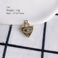 Detailed view of a golden evil eye pendant with white rhinestones, size 11x16x2mm - 13# (Eye)