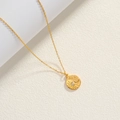 Detail of 18K gold-plated star and moon pendant with shimmering cubic zirconia stone - Gold-Zirconia Sun Moon Circular Pendant