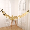 Golden mirror Happy Birthday banner with party hat elements hanging on a white wall - Birthday Hat Style / Gold