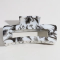 Detail view of the floral ink pattern on a rectangular white resin hair claw clip - Black and White Print