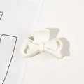 Detail shot of a matte white bow hair claw clip showing fine teeth and spring structure - 4.5CM / 4.5cm Bowknot-Milk White