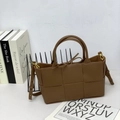 Brown woven leather tote bag with bow detail and adjustable shoulder strap - Caramel color