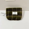 Close-up of green checkered plush pouch with mayrabbit textile label and soft texture - Woolen Style / Yellow Green Brown Plaid