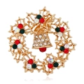 Christmas wreath brooch featuring gold bell and colorful rhinestones on a white background - BR1328 KC Gold Wreath Bell