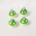 Set of four green resin mushroom charms with white polka dots for DIY jewelry making - Light Green