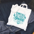 White canvas tote bag with teal 'Be the Reason Someone Smiles' text on denim background - C4/No Inner Pocket No Zipper