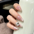 Detail of pink glitter gradient nails with a large rectangular rhinestone on the ring finger - By1541 Ice Curling Autumn Moon / Glue Type