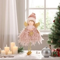 Cute pink plush angel ornament with gold wings and bell hanging by a Christmas tree - Pink Dress Girl Pendant