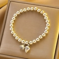 Silver bead bracelet featuring lotus pod and bud pendants in a golden velvet gift box - Silver Lotus Seed Pod Bracelet (X749)