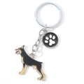 Metal Doberman keychain with enamel paw print charm on a clean white background - Paw Doberman (M10190)