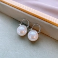Close-up of elegant white pearl earrings with silver needles on a soft pink background - 6# Silver Hoop White Pearl Earrings (13mm)