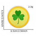 Close-up of a green shamrock embroidered patch with size 6.5cm and weight 2.3g markings - Style 7 (Shamrock on Yellow)
