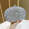 Close-up of silver rhinestone sunflower evening bag with luxurious crystal floral pattern - Silver