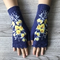 Detailed embroidery of yellow flowers on navy blue knitted fingerless gloves on wood - Sapphire Blue