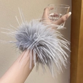 Oversized fluffy grey feather scrunchie accessory worn on wrist for an elegant look - Hair Tie / 13cm / Gray