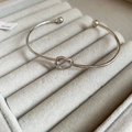 Elegant silver knot open bangle with zircon accents and minimalist spherical ends - Silver Knot Shape Open Cuff Style