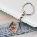 Creative resin water bag keychain featuring a realistic orange tropical fish pendant - Red Small Fish